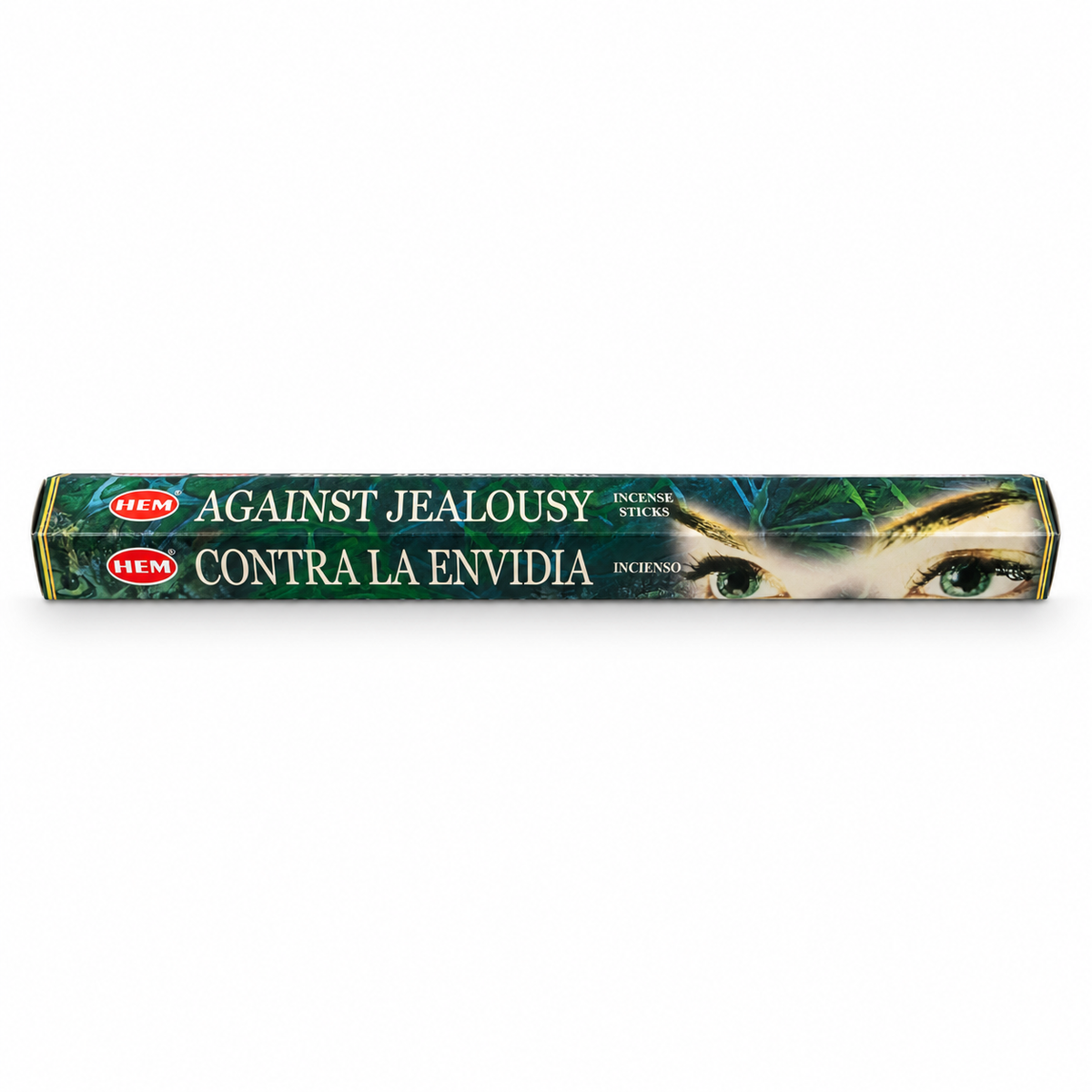 A single stick of HEM incense sticks, labeled 'AGAINST JEALOUSY / CONTRA LA ENVIDIA', featuring a dark green and black design with a close-up of a woman's eye on the packaging, set against a plain white background.