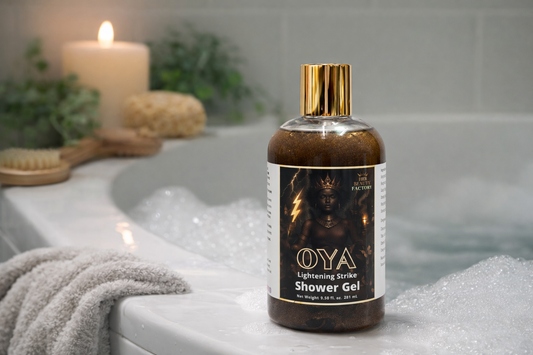 OYA shower gel bottle on a bathtub with candles and bath items in the background
