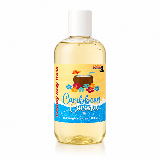 A bottle of Caribbean Coconut Creamy Body Wash by Lakay Remedies. The product is a clear plastic bottle filled with a pale yellow liquid, featuring a white cap and a colorful tropical-themed label with a coconut drink illustration.