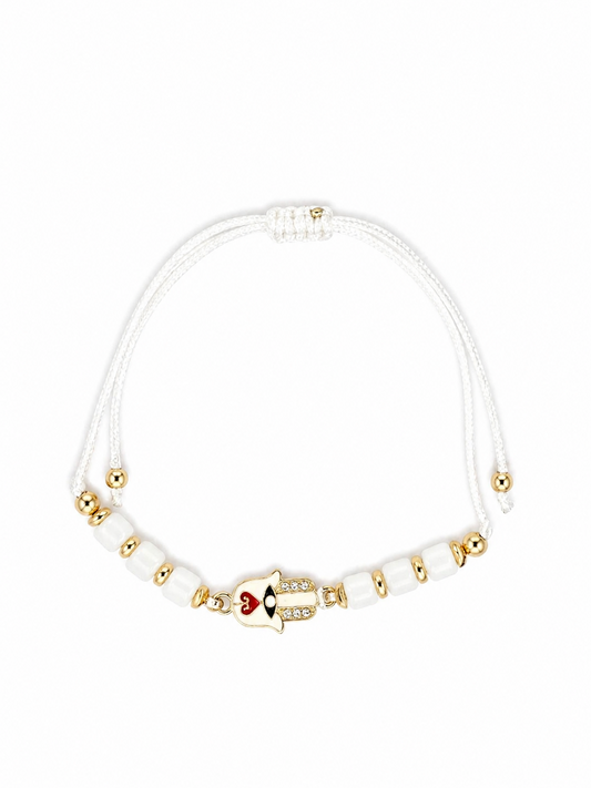 Bracelet with heart-shaped on Hamsa Hand on a white background