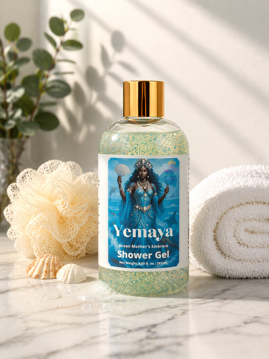 Bottle of Yemaya Shower Gel on a marble surface with a plant and towel in the background