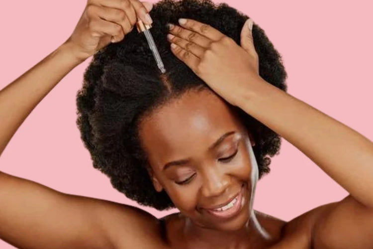 Woman applying hair oil