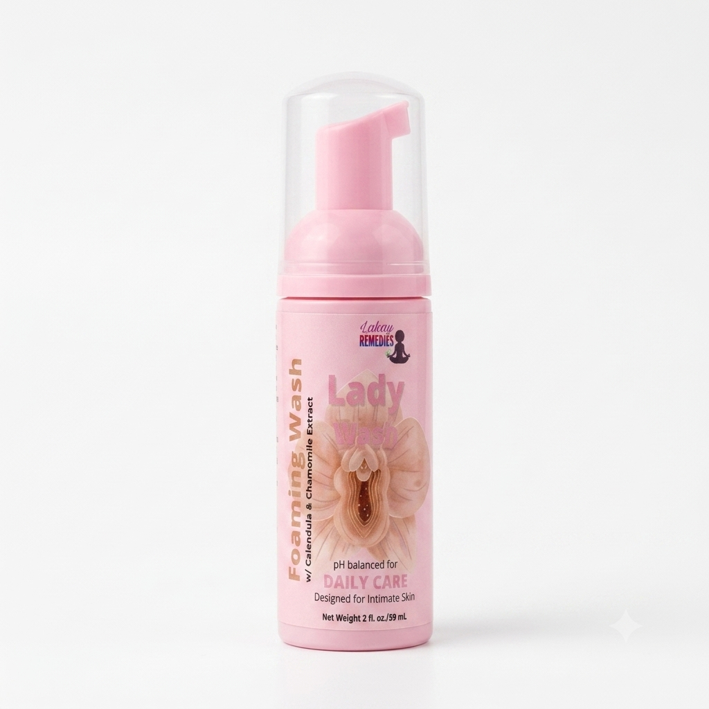 A pink foaming wash bottle with a clear cap and pink pump dispenser, labeled 'Lady Bits Foaming Wash' on a clean white background.