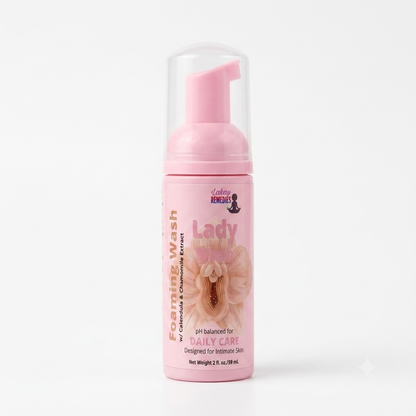 A pink foaming wash bottle with a clear cap and pink pump dispenser, labeled 'Lady Bits Foaming Wash' on a clean white background.