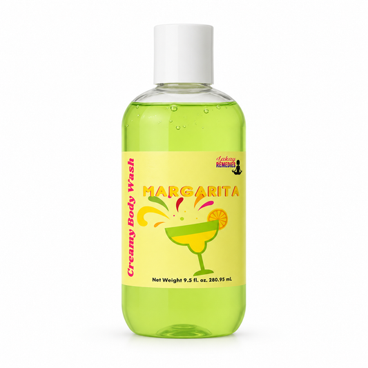 A bottle of Creamy Body Wash in the Margarita scent, featuring a bright yellow label with a margarita glass illustration and green liquid inside a clear bottle with a white cap.