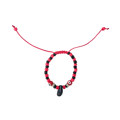 Beaded bracelet with red and black beads on a white background