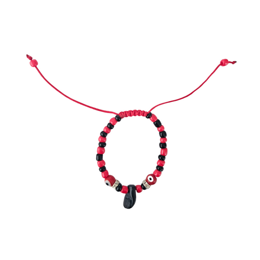 Beaded bracelet with red and black beads on a white background