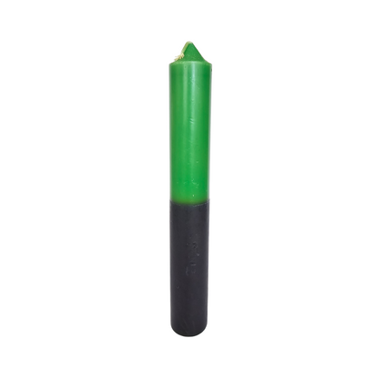 Green and black candle on a white background