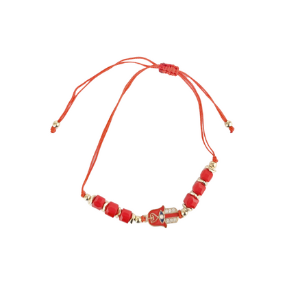 Hamsa Hand Red beaded bracelet with gold accents on a white background