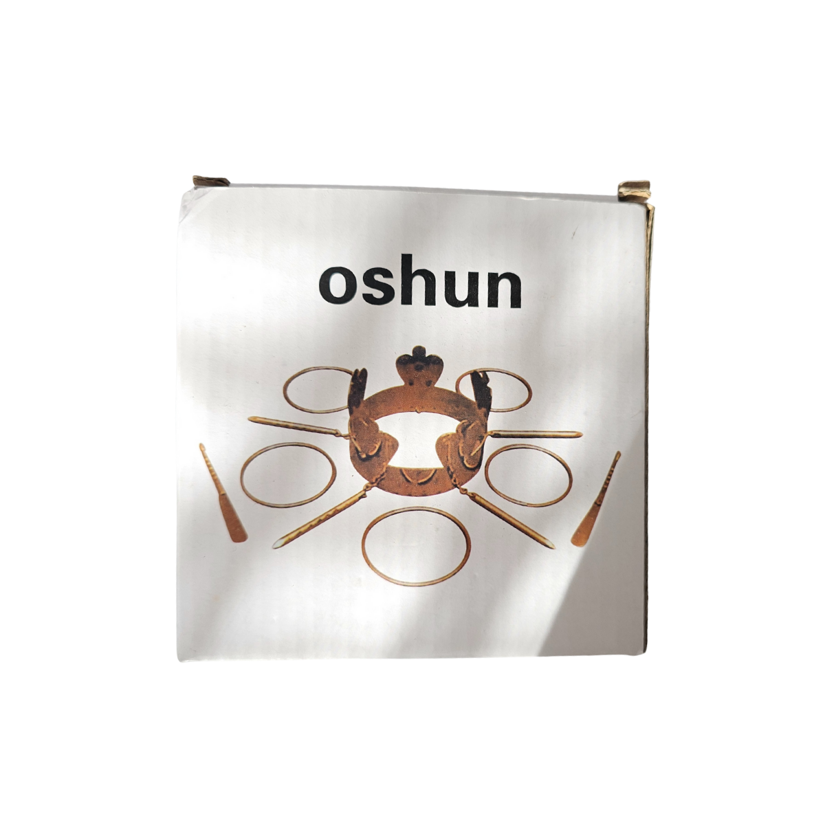 White box with 'oshun' branding design on a white background