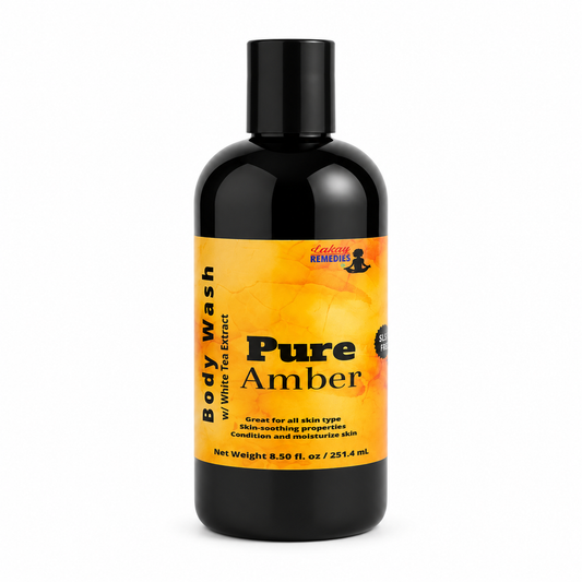A bottle of Pure Amber Body Wash by, featuring a black bottle with a black cap and a bright orange label, set against a plain white background.