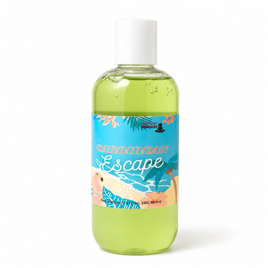A clear plastic bottle filled with light green Body Wash, featuring a white cap and a colorful tropical beach-themed label that reads 'Caribbean Escape'.