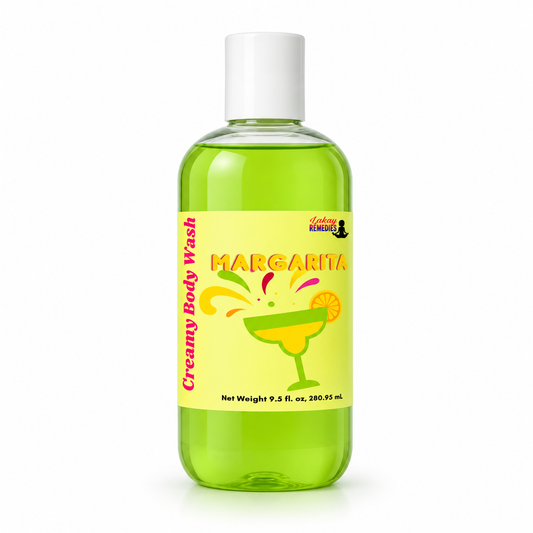 A bottle of Creamy Body Wash in the Margarita scent, featuring a bright yellow label with a margarita glass illustration and lime graphics, set against a plain white background.