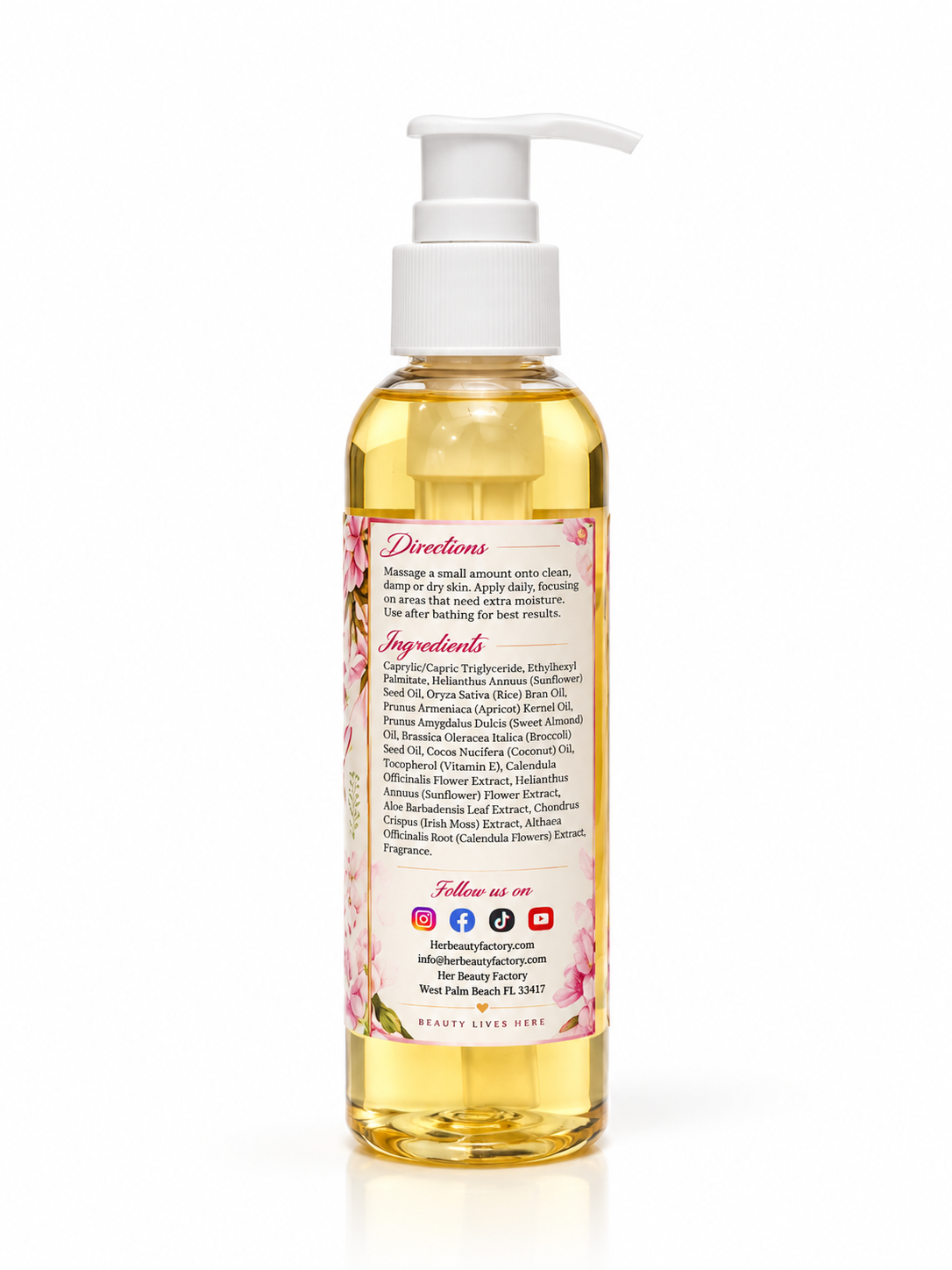 A clear plastic pump bottle filled with pale yellow liquid, shown from the back on a white background. The bottle has a white pump dispenser and a pink floral label with black text detailing ingredients and directions.