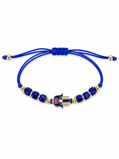 Blue beaded bracelet with a heart-shaped on Hamsa Hand on a white background