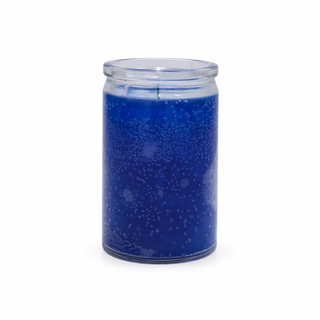 Blue speckled candle in a glass jar on a white background