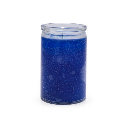 Blue speckled candle in a glass jar on a white background