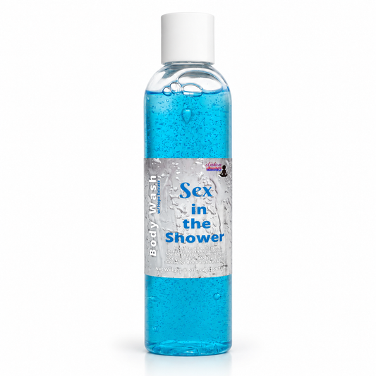 A clear plastic bottle of blue body wash with a white cap and a silver label reading 'Sex in the Shower' on a white background.