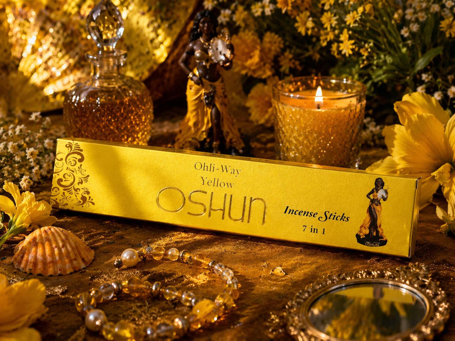 Yellow Oshun incense sticks box with decorative items on a wooden surface