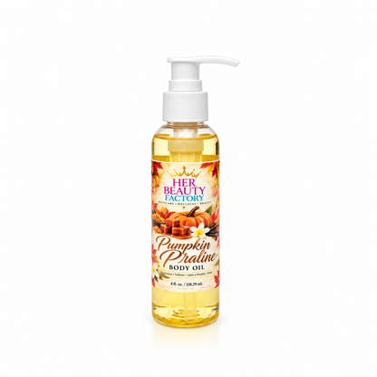 A bottle of Her Beauty Factory Pumpkin Praline Body Oil with a white pump dispenser, containing golden yellow oil, set against a plain white background.