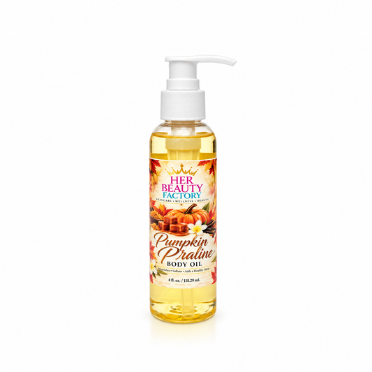 A bottle of Her Beauty Factory Pumpkin Praline Body Oil with a white pump dispenser, containing golden yellow oil, set against a plain white background.