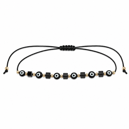 Black and gold beaded bracelet on a white background