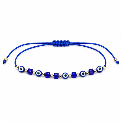 Blue beaded bracelet with evil eye symbols on a white background
