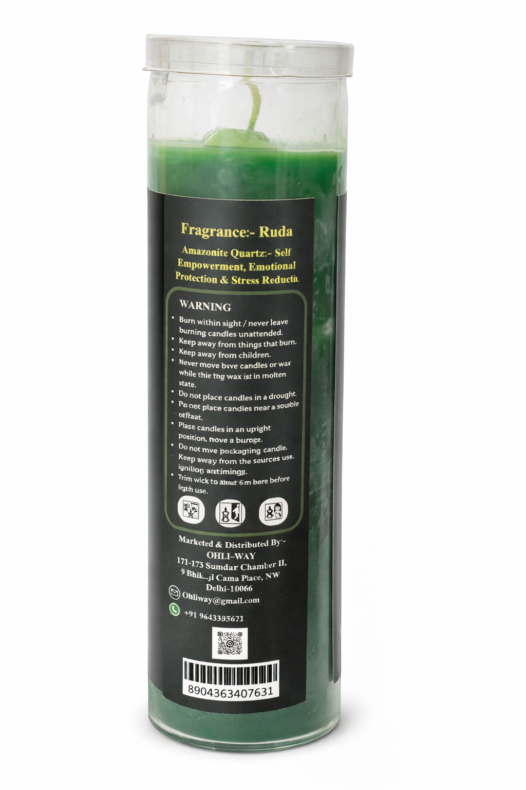 Green candle in a cylindrical container with text on a white background