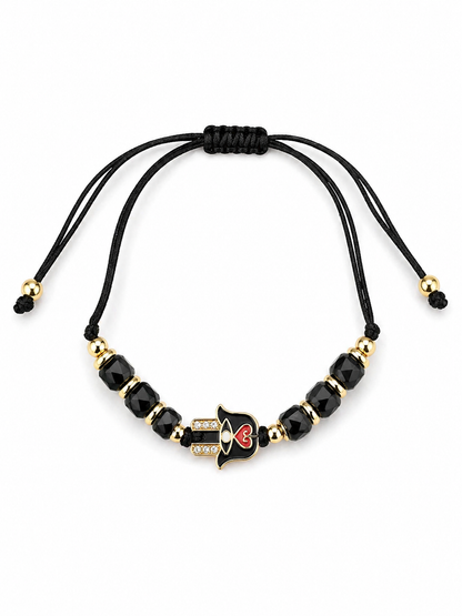 Black beaded bracelet with gold accents on a white background
