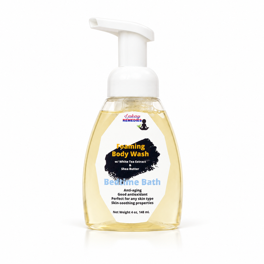 A bottle of Lakay Remedies Bedtime Bath foaming body wash with a white pump dispenser and a clear bottle showing the pale yellow liquid inside, set against a plain white background.