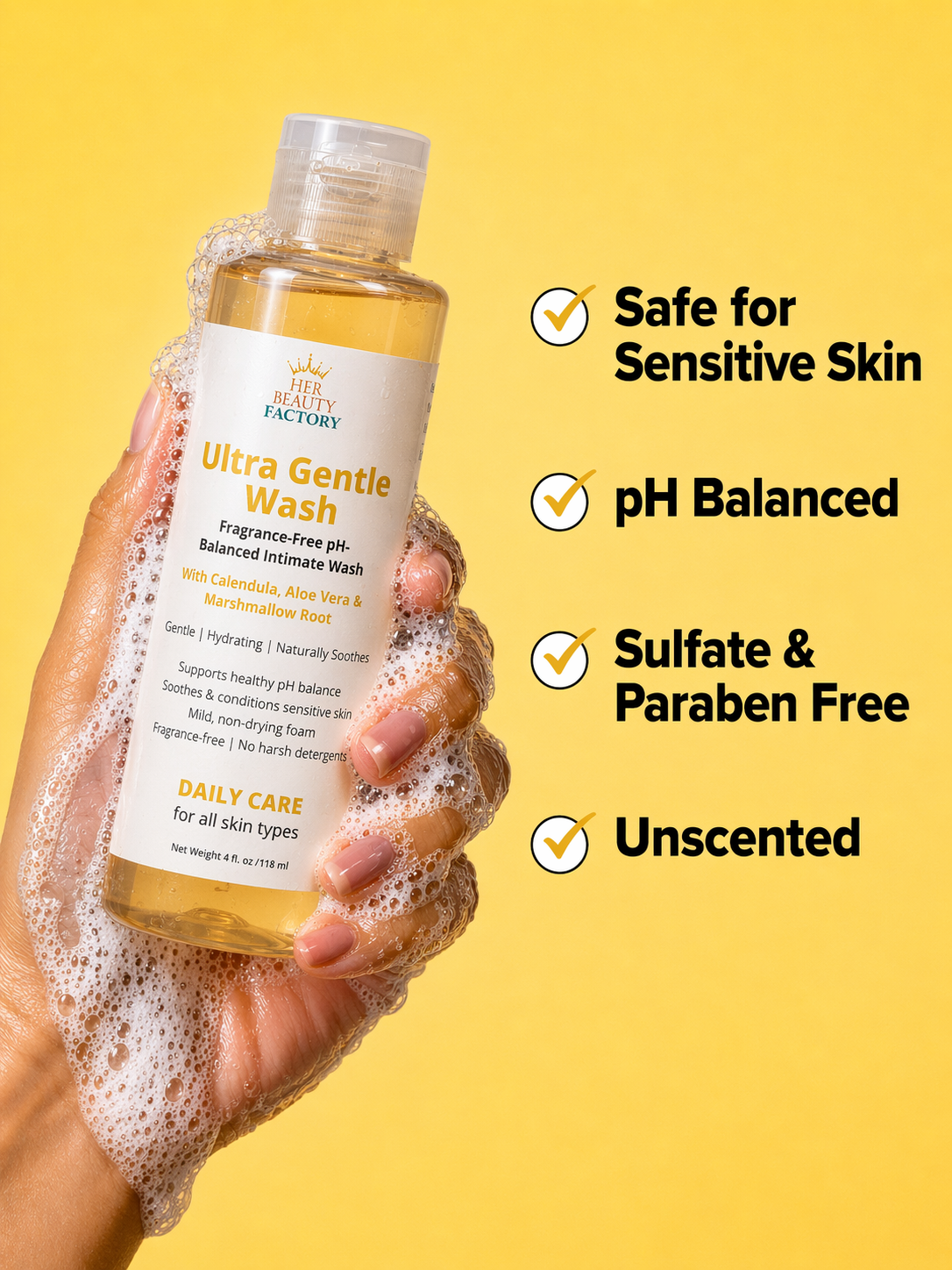 Bottle of Ultra Gentle Wash with a hand holding it, on a yellow background with product features listed.