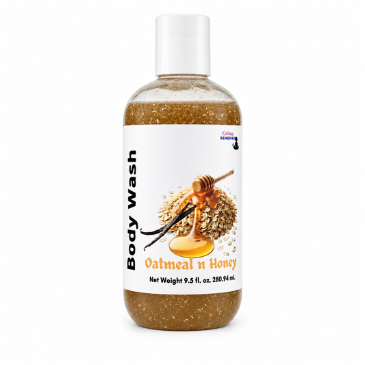 A bottle of oatmeal and honey body wash with a white cap and white label, showing brown speckled liquid inside. The label features an illustration of oats, honey, and vanilla beans.