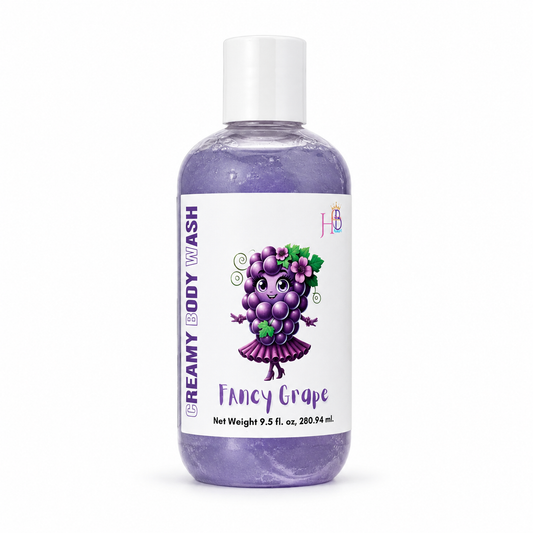 A bottle of Her Beauty Factory Creamy Body Wash in the Fancy Grape scent, featuring a purple grape character illustration on a white label, set against a plain white background.