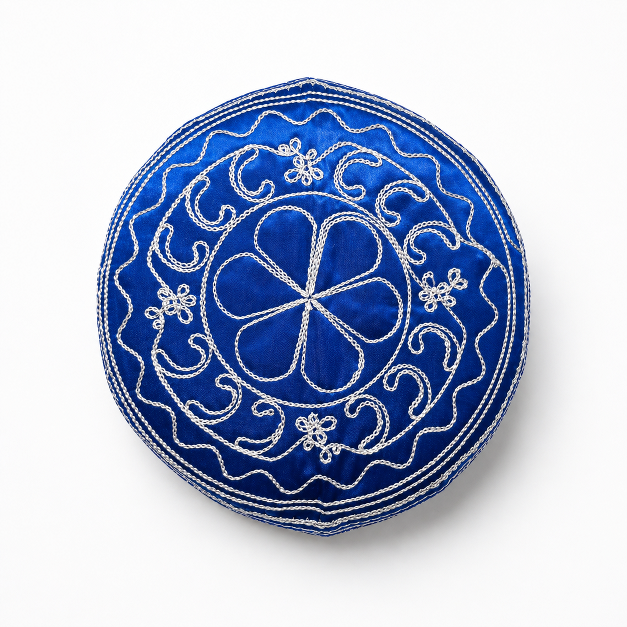 Blue embroidered hat with white patterns on a white background