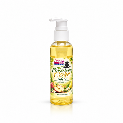 A bottle of Lakay Remedies Fresh to the Core Body Oil with a white pump dispenser, filled with yellow oil, set against a plain white background.