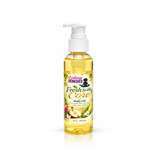 A bottle of Lakay Remedies Fresh to the Core Body Oil with a white pump dispenser, filled with yellow oil, set against a plain white background.