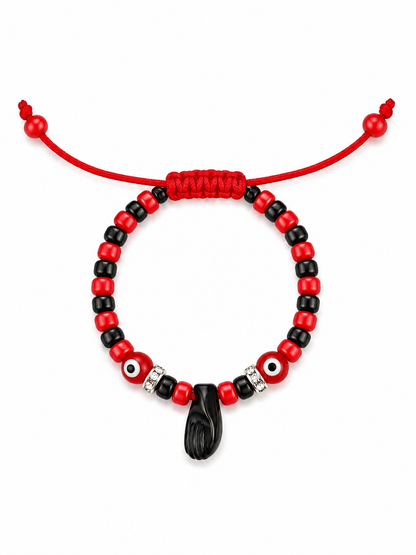 Red and black beaded bracelet with a black hand charm on a white background