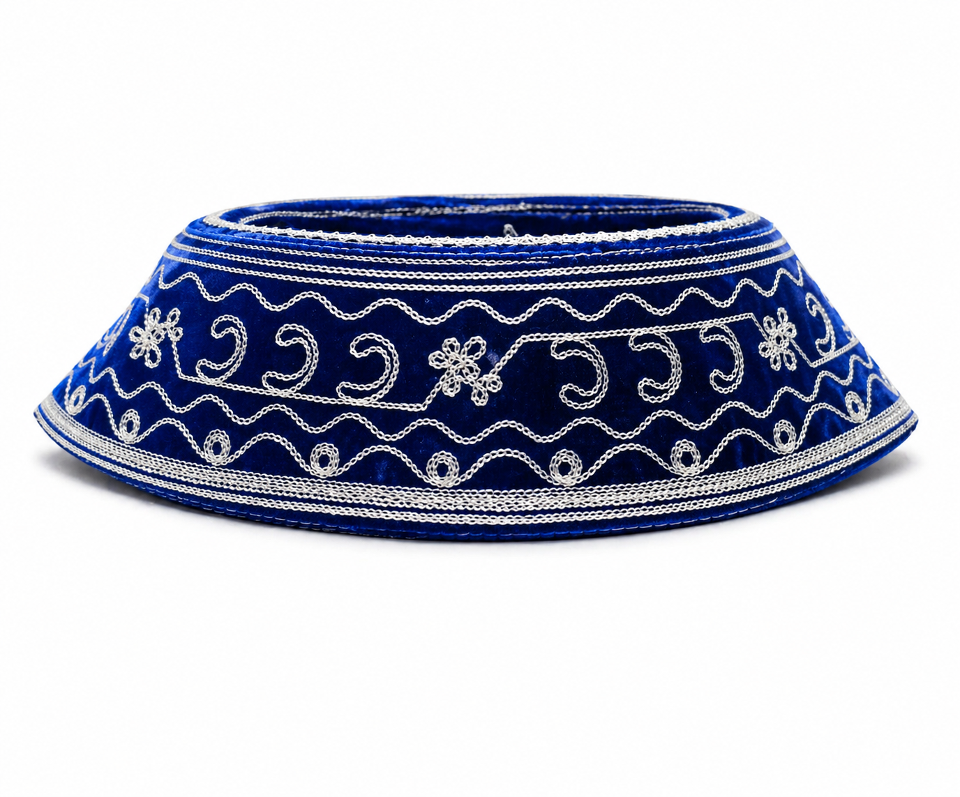 Blue decorative hat with white embroidery on a white background