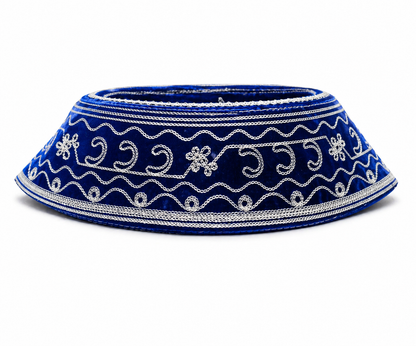 Blue decorative hat with white embroidery on a white background