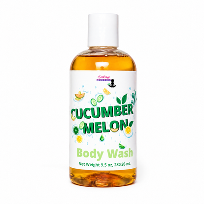 A bottle of Laking Remedies Cucumber Melon Body Wash, featuring amber-colored liquid inside a clear bottle with a white cap and a white label decorated with green and yellow citrus illustrations.