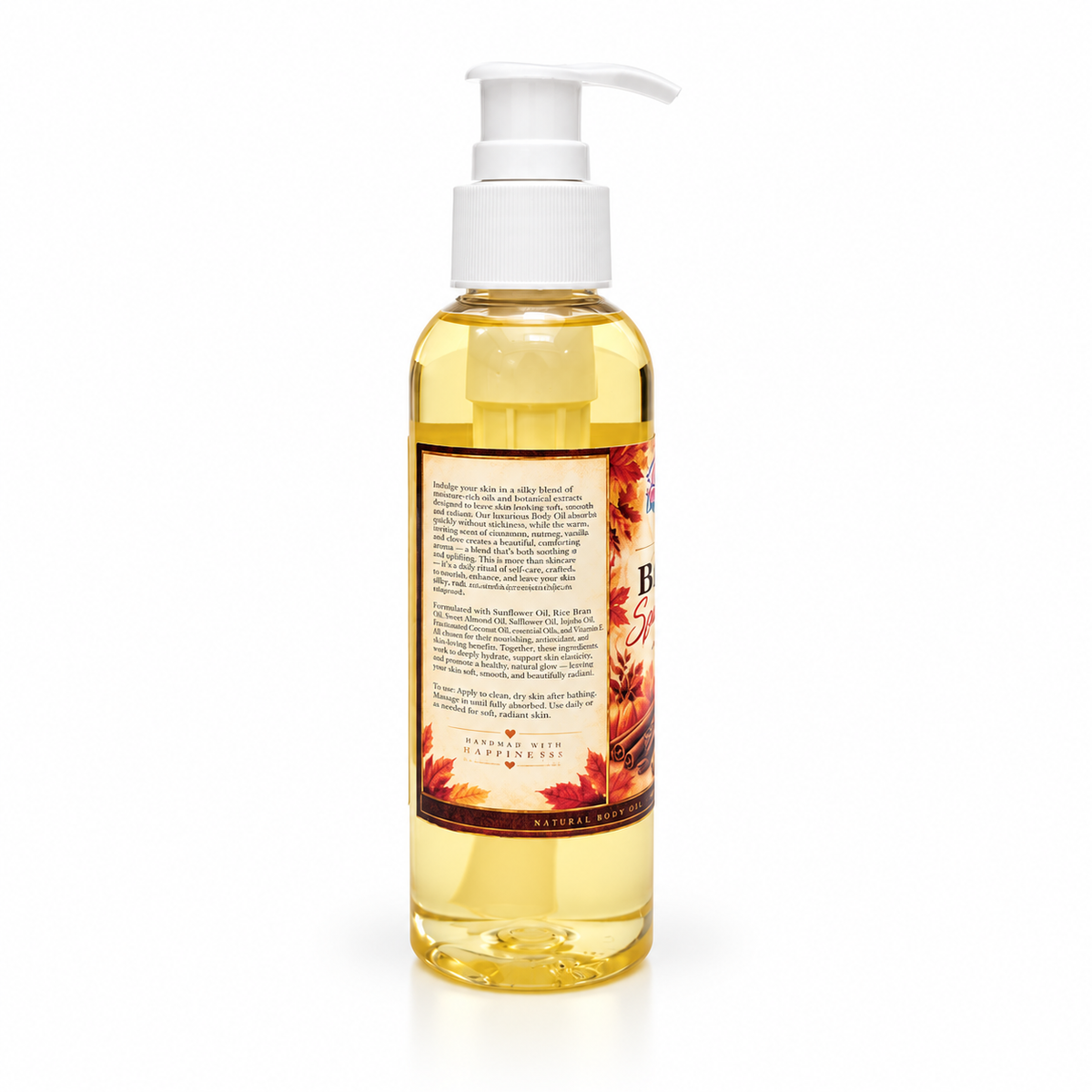 A bottle of Spiced Pumpkin body oil with a white pump dispenser, showing the back label and golden-yellow liquid inside, on a white background.