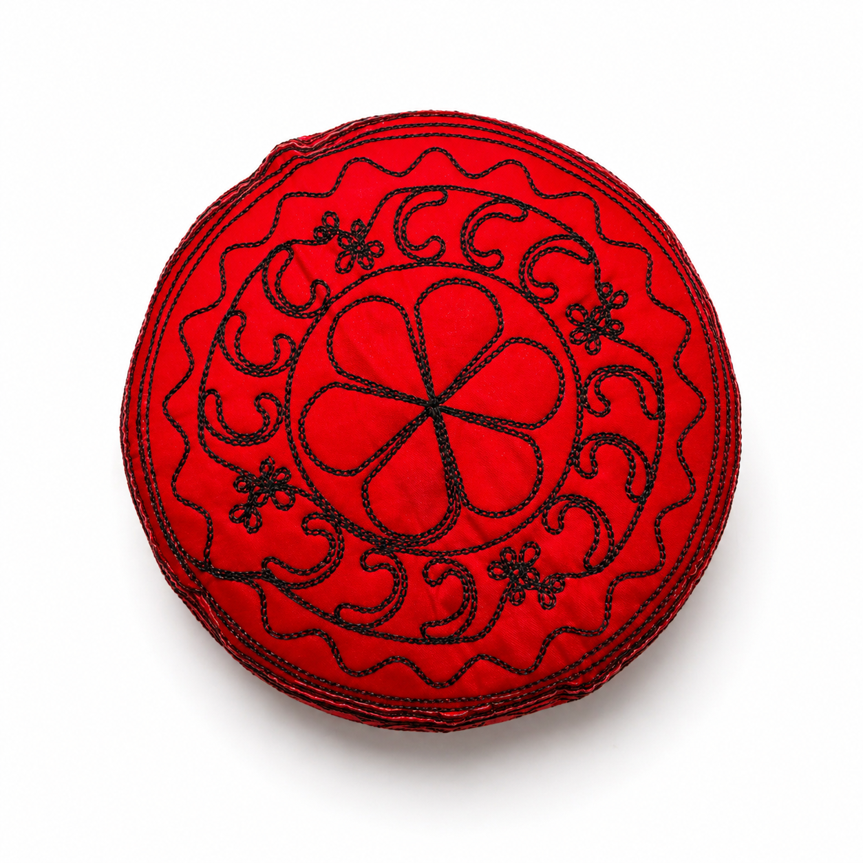 Red hat with black embroidery on a white background