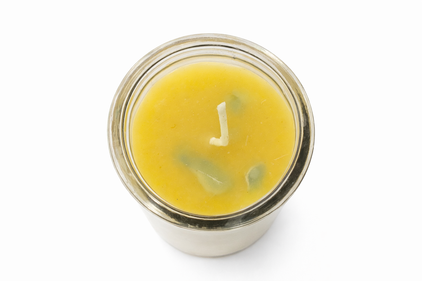 Yellow candle in a glass jar on a white background