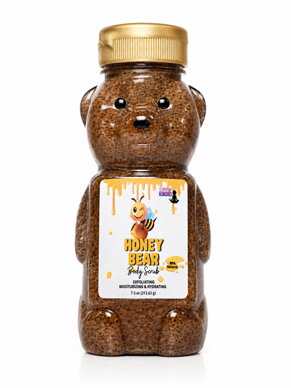 A bear-shaped plastic bottle of Honey Bear Body Scrub with a gold cap and a white label featuring a cartoon bee, shown on a white background.