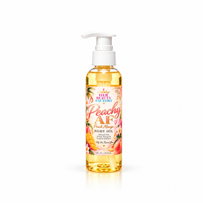 A bottle of Her Beauty Factory Peachy AF Fruit Mango Body Oil with a white pump dispenser, filled with golden yellow oil and decorated with peach and mango illustrations on the label, set against a plain white background.