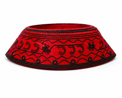Red hat with black patterns on a white background