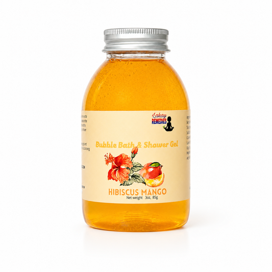 A bottle of Lakay Remedies Bubble Bath & Shower Gel in Hibiscus Mango scent, filled with golden orange gel and featuring a cream-colored label with red hibiscus and mango illustrations, topped with a silver metal cap.