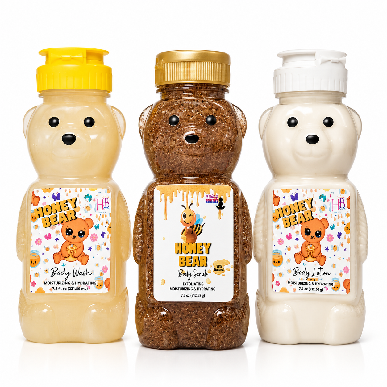 Three bear-shaped body wash, scrub and lotion bottles on a white background: a pale yellow bottle labeled Honey Bear Body Wash with a yellow cap, a medium brown bottle labeled Honey Bear Body Scrub with a gold cap, and a creamy off-white bottle labeled Honey Bear Body Lotion with a white cap.