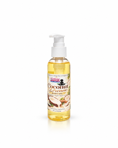 A bottle of Lakay Remedies Coconut Cream Body Oil with a white pump dispenser, containing a golden yellow oil, set against a plain white background.