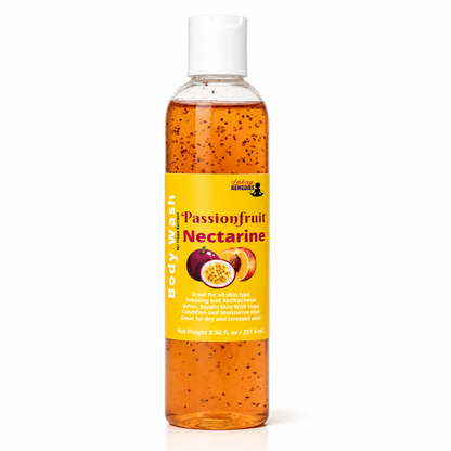 A bottle of Passionfruit Nectarine body wash by The Body Works, featuring a yellow label and white cap, filled with orange liquid containing small dark fruit seeds, on a white background.